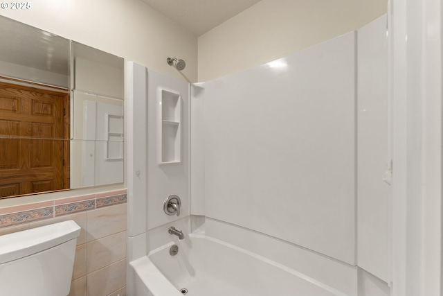 full bathroom with toilet and bathtub / shower combination