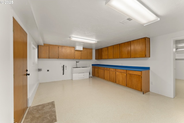 laundry area featuring light floors and visible vents