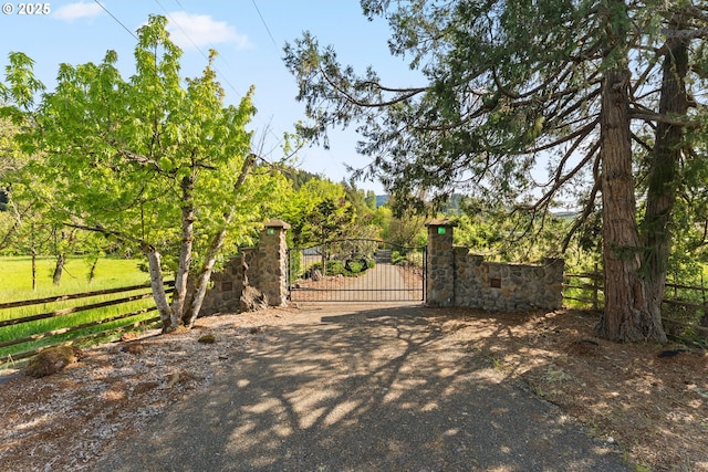 view of gate featuring fence