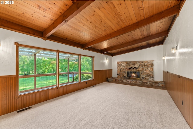 unfurnished living room with wood walls, wainscoting, and wood ceiling