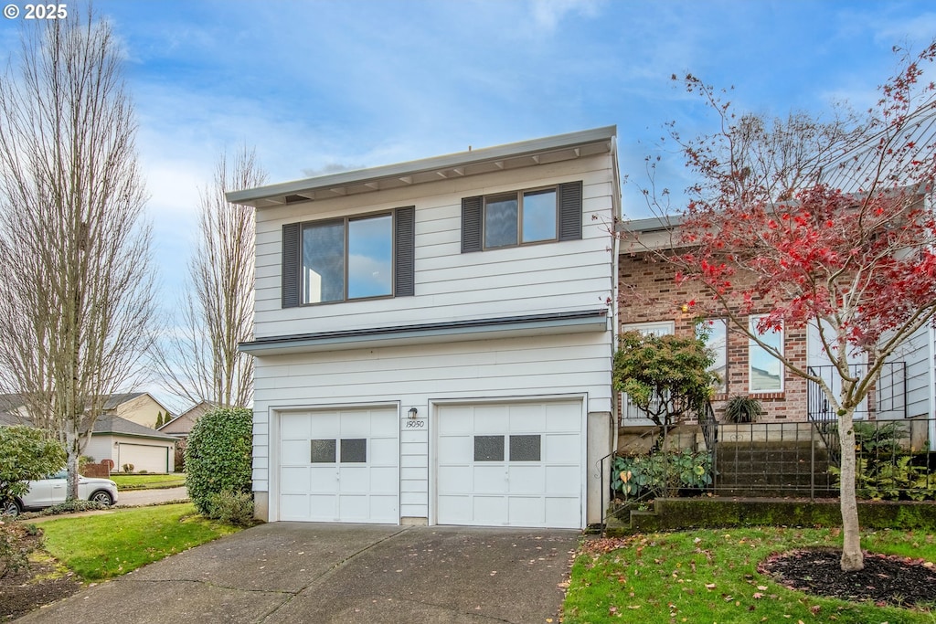 15050 NE Rose Pkwy, Portland, OR 97230 - view of front facade with a garage and concrete driveway