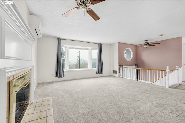 unfurnished living room with an AC wall unit, ceiling fan, and light carpet