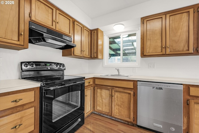 kitchen with sink, light wood-type flooring, black electric range, and stainless steel dishwasher