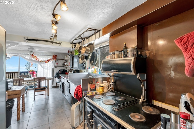 6596 River Rd, Salem, OR 97306 - kitchen with a textured ceiling and tile patterned floors