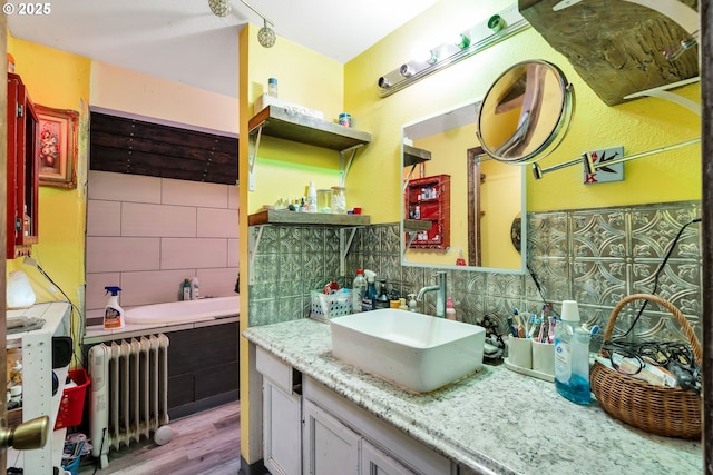 6596 River Rd, Salem, OR 97306 - kitchen featuring open shelves, a sink, radiator, wood finished floors, and backsplash