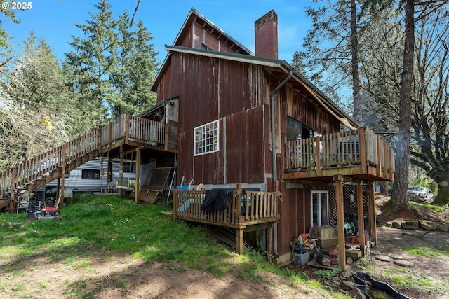 6596 River Rd, Salem, OR 97306 - back of house featuring stairway, a wooden deck, and a chimney