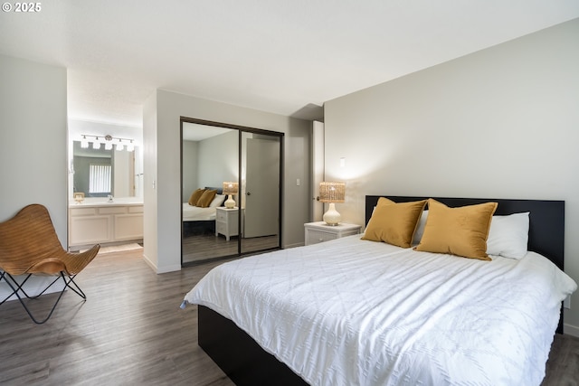 2024 Lake Isle Dr Unit 2024, Eugene, OR 97401 - bedroom featuring wood finished floors, a closet, and ensuite bath