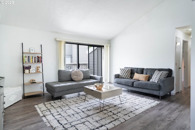 2024 Lake Isle Dr Unit 2024, Eugene, OR 97401 - living area with wood finished floors, lofted ceiling, and radiator