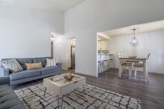 2024 Lake Isle Dr Unit 2024, Eugene, OR 97401 - living room featuring wood finished floors and a high ceiling