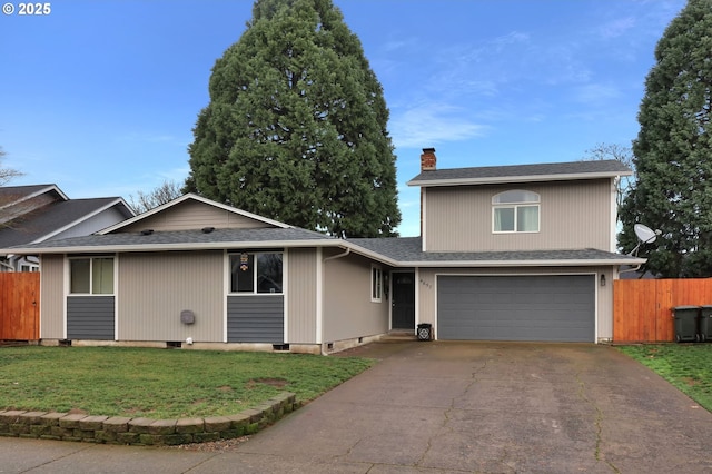 view of front facade with a garage and a front yard