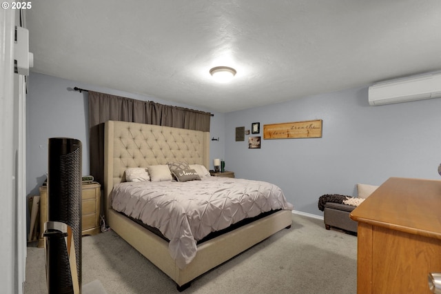 bedroom with light colored carpet and an AC wall unit