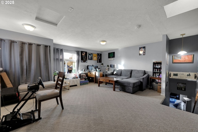 carpeted living room featuring a textured ceiling