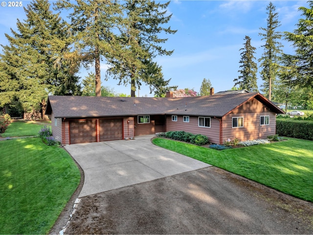 ranch-style house with a garage, a front yard, driveway, and a chimney