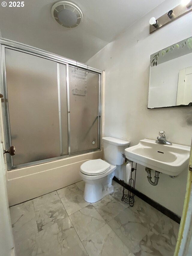 1412 5th St, Tillamook, OR 97141 - bathroom featuring toilet, marble finish floor, visible vents, a sink, and combined bath / shower with glass door