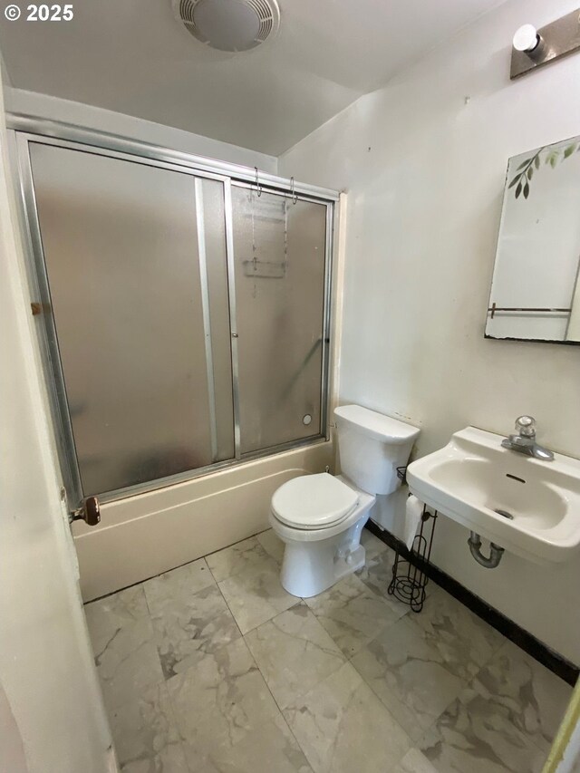 1412 5th St, Tillamook, OR 97141 - bathroom with a sink, toilet, marble finish floor, and enclosed tub / shower combo