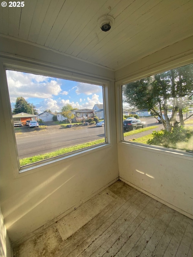 1412 5th St, Tillamook, OR 97141 - unfurnished sunroom featuring a wealth of natural light and hardwood / wood-style floors