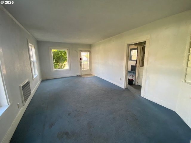 1412 5th St, Tillamook, OR 97141 - unfurnished living room featuring baseboards and visible vents