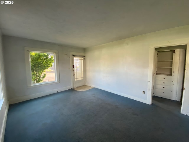1412 5th St, Tillamook, OR 97141 - unfurnished room with baseboards and dark carpet
