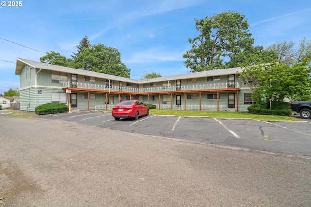 view of property with uncovered parking