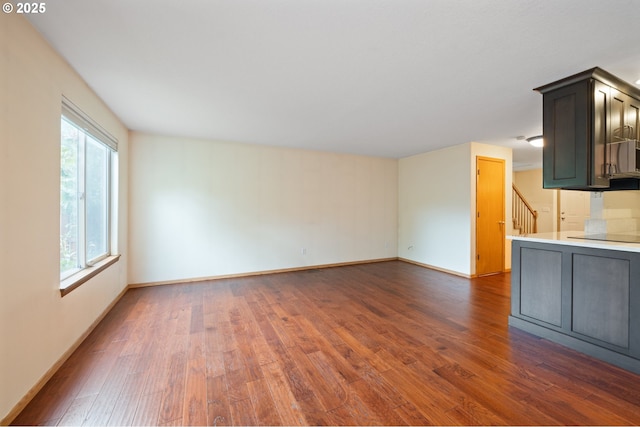 7501 NE 51st Way, Vancouver, WA 98662 - unfurnished living room with wood finished floors, baseboards, and stairs