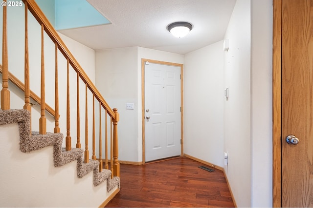 7501 NE 51st Way, Vancouver, WA 98662 - foyer entrance with wood finished floors, baseboards, stairway, and a textured ceiling