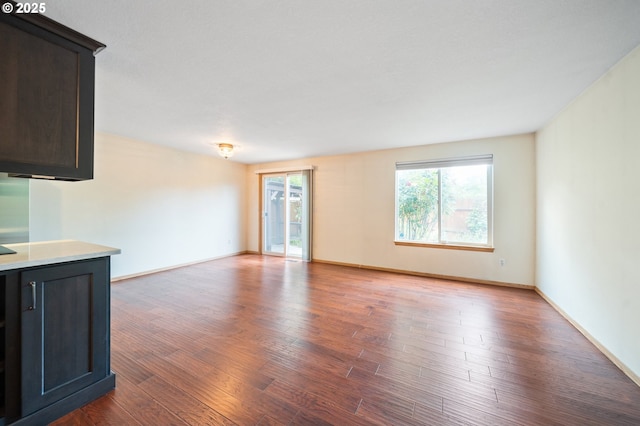 7501 NE 51st Way, Vancouver, WA 98662 - unfurnished living room featuring wood finished floors and baseboards
