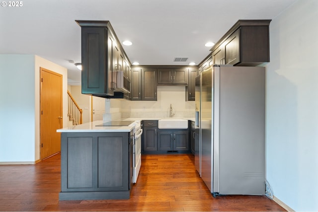 7501 NE 51st Way, Vancouver, WA 98662 - kitchen featuring appliances with stainless steel finishes, a sink, recessed lighting, dark wood-style flooring, and light countertops