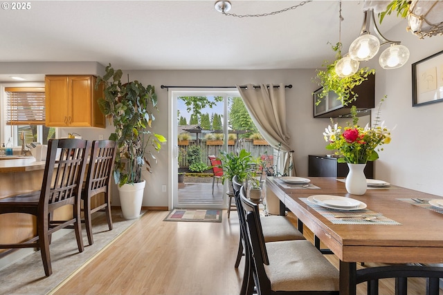 dining space with light wood-style floors