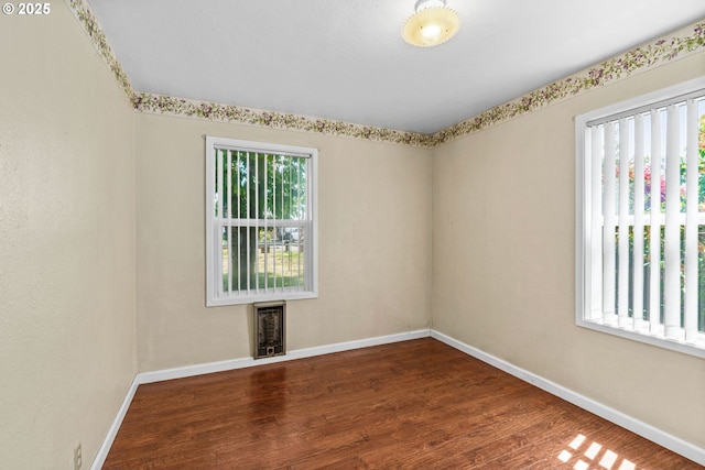 2386 Clear Vue Ln, Springfield, OR 97477 - unfurnished room with heating unit, baseboards, and wood finished floors