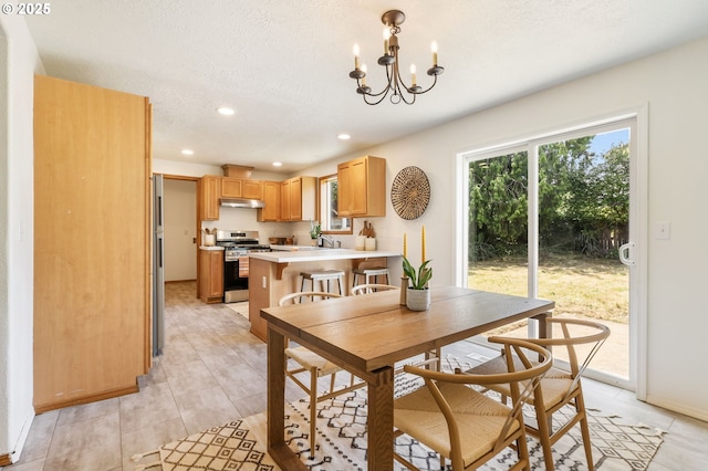 6837 SE 84th Ave, Portland, OR 97266 - dining room featuring a chandelier, recessed lighting, light tile patterned floors, and a textured ceiling
