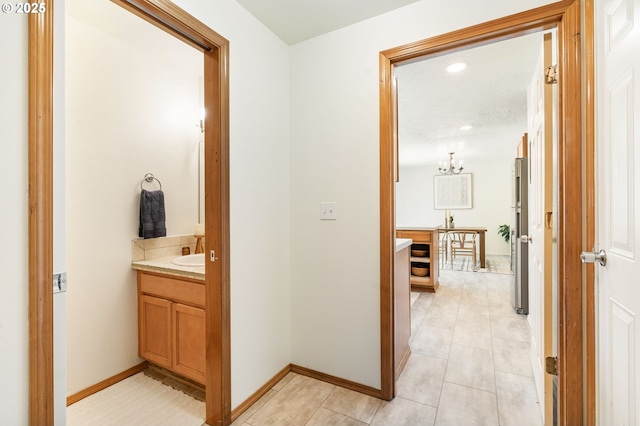 6837 SE 84th Ave, Portland, OR 97266 - hall featuring a chandelier, light tile patterned flooring, and recessed lighting