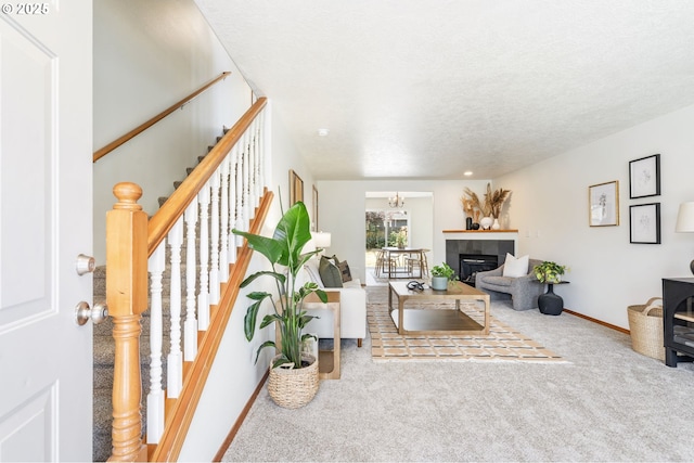 6837 SE 84th Ave, Portland, OR 97266 - living room with carpet, stairway, a textured ceiling, and a fireplace