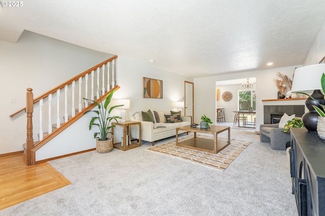 6837 SE 84th Ave, Portland, OR 97266 - living area featuring stairs, a fireplace, carpet flooring, recessed lighting, and a chandelier