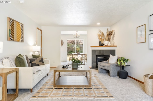 6837 SE 84th Ave, Portland, OR 97266 - living area with carpet floors, a fireplace, a chandelier, and a textured ceiling