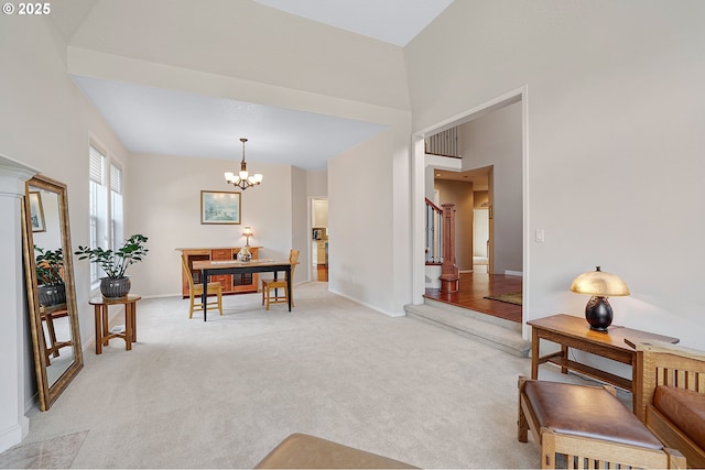 4710 SW Joshua St, Tualatin, OR 97062 - dining room with a chandelier, light colored carpet, and stairway