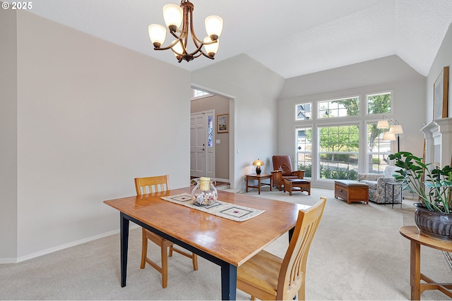 4710 SW Joshua St, Tualatin, OR 97062 - dining room featuring light carpet, a chandelier, and vaulted ceiling