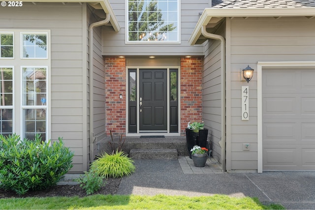 4710 SW Joshua St, Tualatin, OR 97062 - view of exterior entry featuring a garage and brick siding