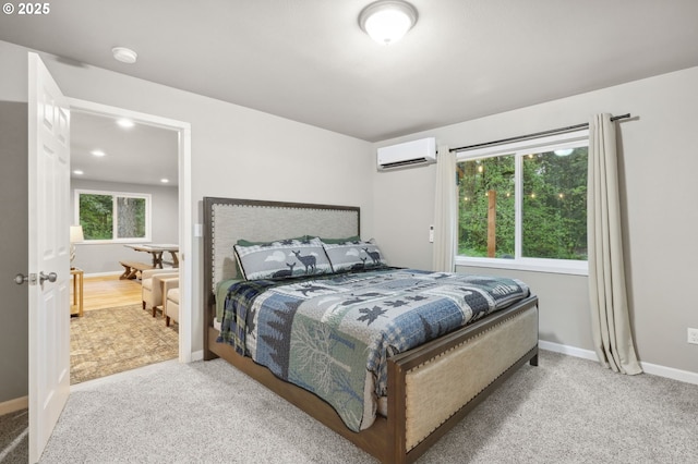 23595 E Lolo Pass Rd, Rhododendron, OR 97049 - carpeted bedroom with an AC wall unit, baseboards, and ensuite bathroom