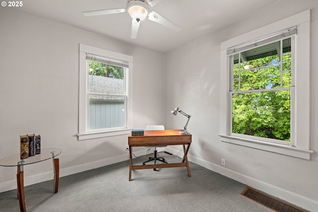 office area with baseboards, healthy amount of natural light, and ceiling fan