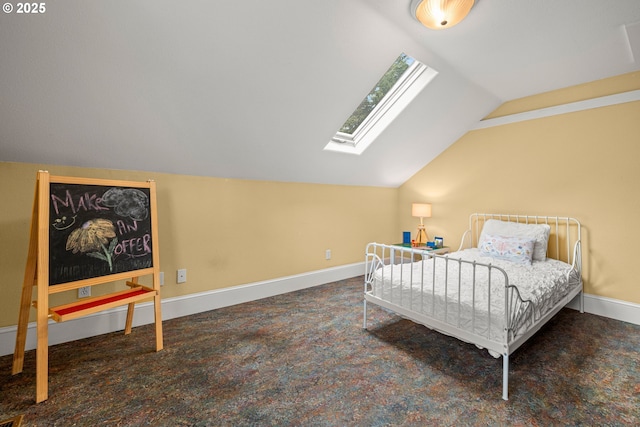 bedroom featuring a skylight, vaulted ceiling, and baseboards