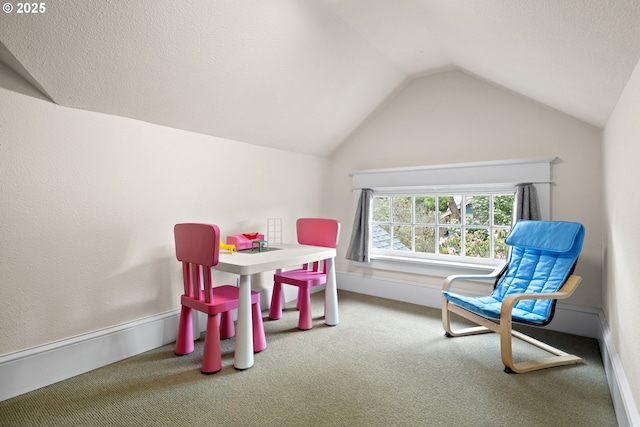 game room with vaulted ceiling and carpet
