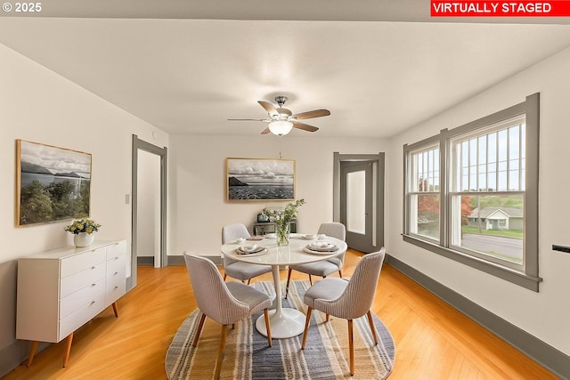 339 W Laurelwood Ct, Roseburg, OR 97470 - dining space with light wood-type flooring, a ceiling fan, and baseboards