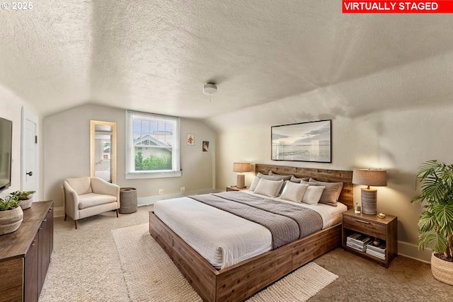 339 W Laurelwood Ct, Roseburg, OR 97470 - bedroom with vaulted ceiling, light colored carpet, a textured ceiling, and baseboards