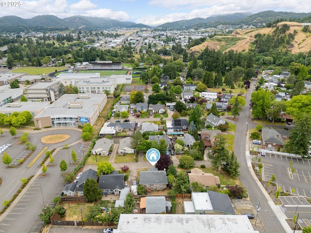 339 W Laurelwood Ct, Roseburg, OR 97470 - aerial overview of property's location featuring a mountainous background and nearby suburban area