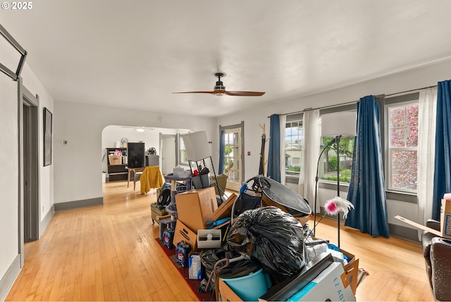 339 W Laurelwood Ct, Roseburg, OR 97470 - living area with a ceiling fan, light wood-style flooring, baseboards, and arched walkways