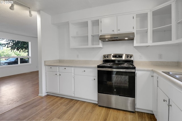 1437 Sequoia Ave, Springfield, OR 97477 - kitchen with under cabinet range hood, electric stove, light wood-style flooring, and white cabinets