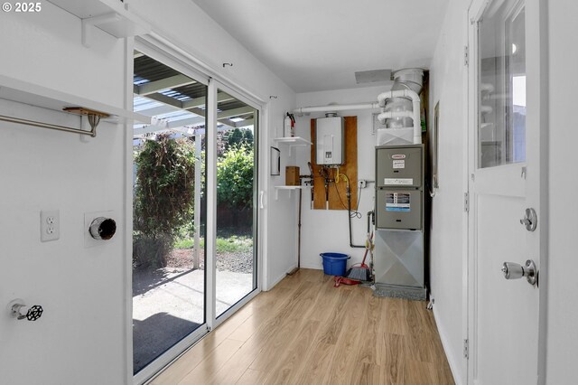 1437 Sequoia Ave, Springfield, OR 97477 - doorway to outside with light wood-style floors and water heater