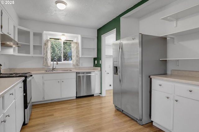 1437 Sequoia Ave, Springfield, OR 97477 - kitchen featuring open shelves, appliances with stainless steel finishes, a sink, exhaust hood, and white cabinets