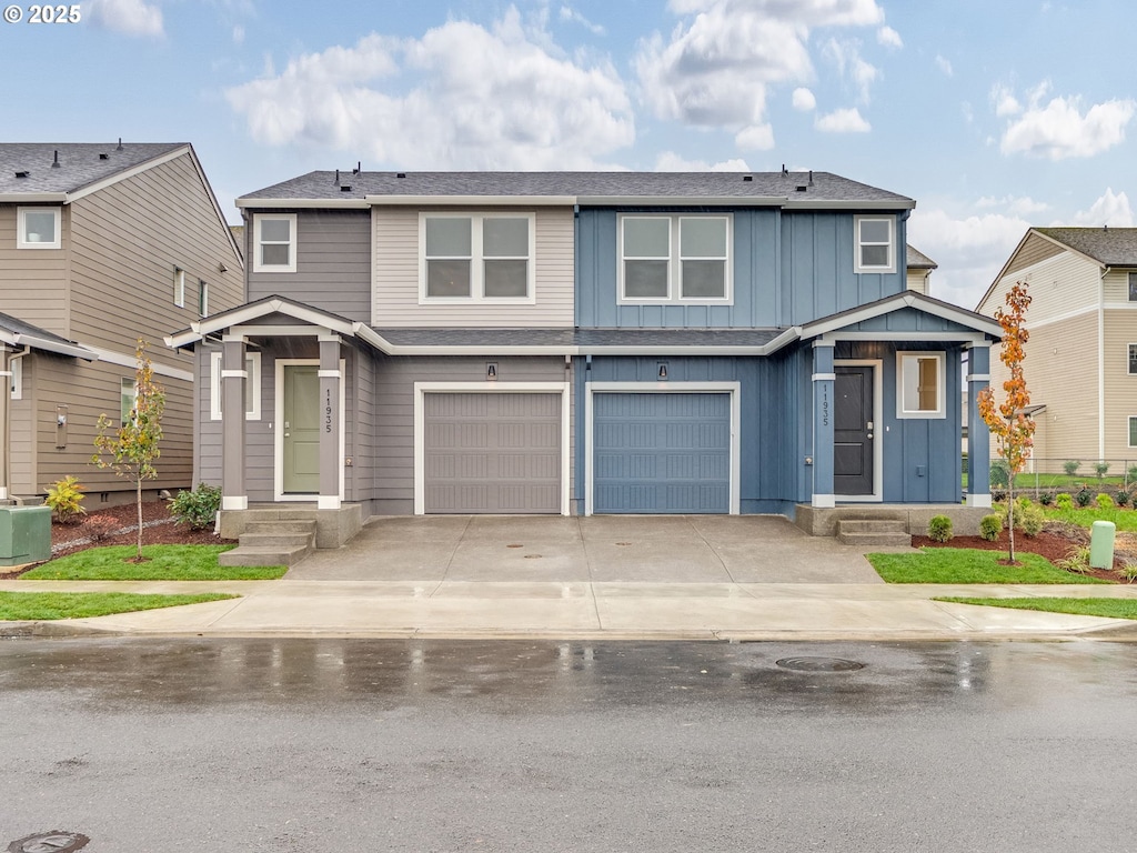 view of front of home with a garage and central AC unit