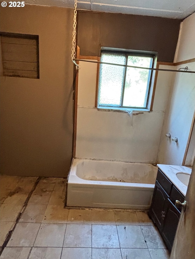 bathroom with bathtub / shower combination, tile patterned flooring, and vanity